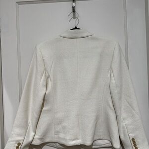 Creamy white short jacket.  Cute with jeans or dressed up. Nice textured fabric.